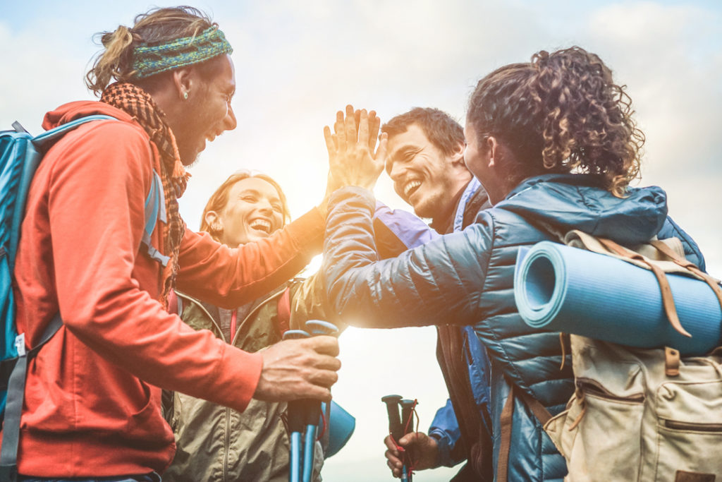 A group of backpackers celebrating.