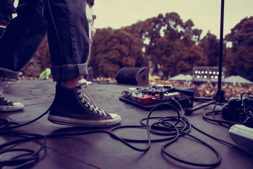 Rock musician playing on stage.