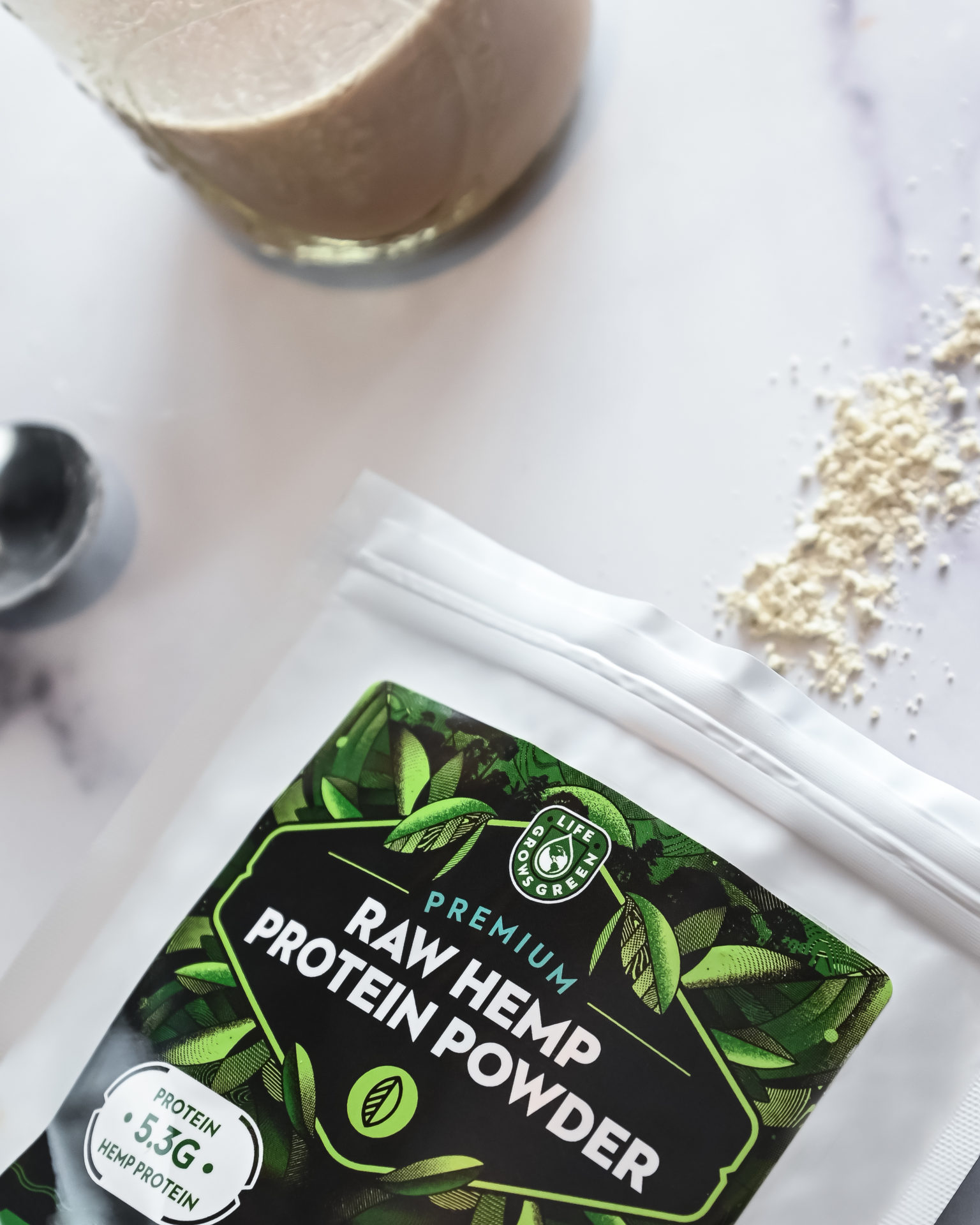 A bag of raw hemp protein powder on a white counter top.